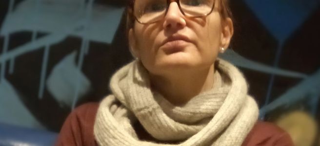 Photo of Jessica Ba wearing a knitted cowl